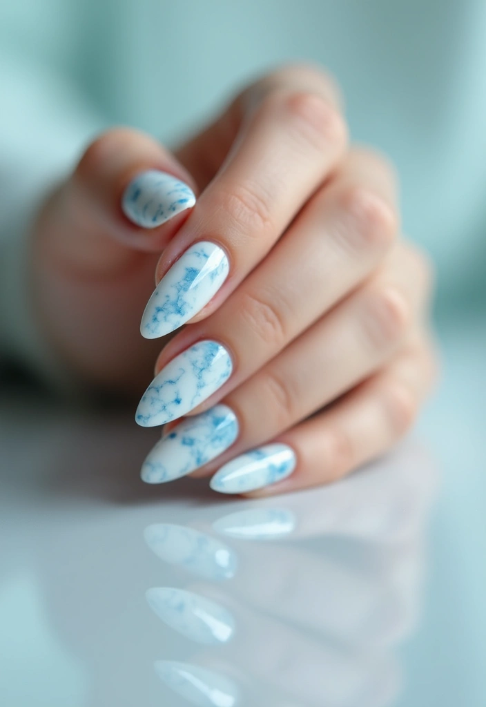 31 Icy Blue Christmas Nail Designs to Brighten December - 7. Icy Marble Effect